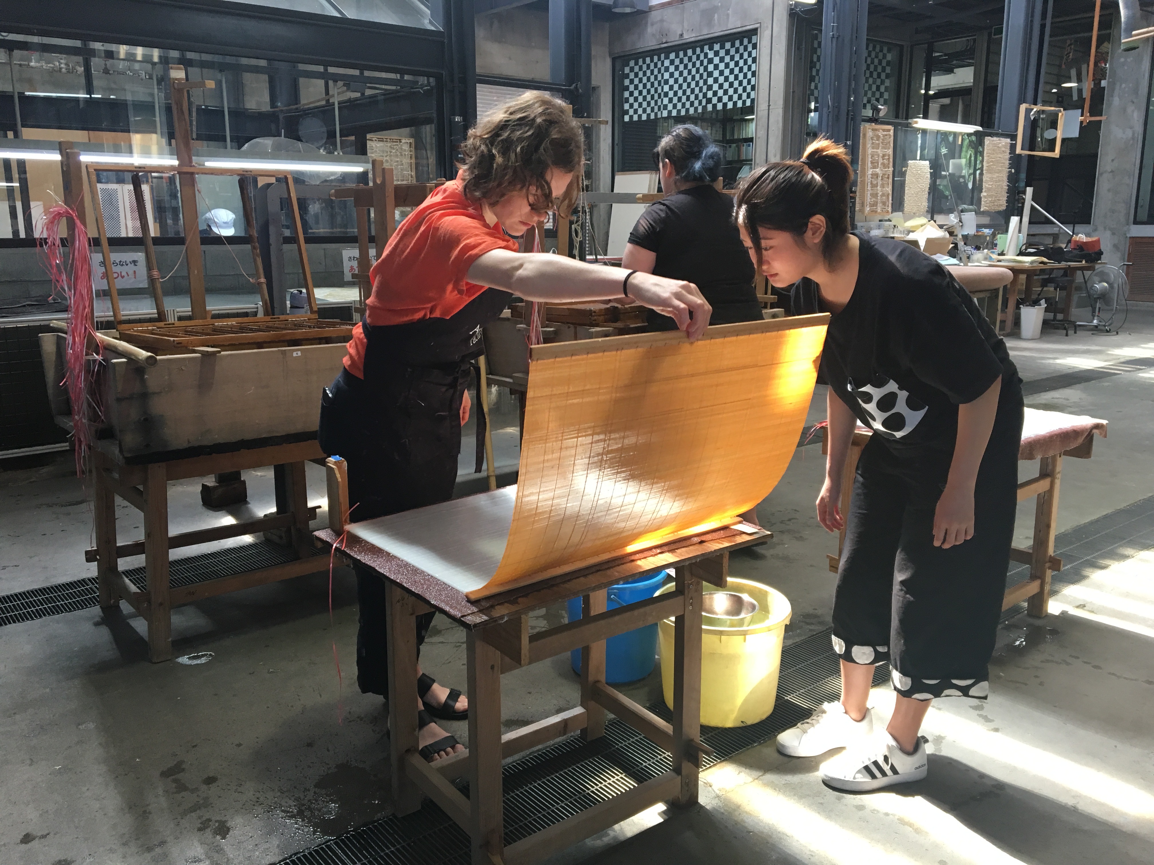 A student makes paper while studying abroad in Japan.