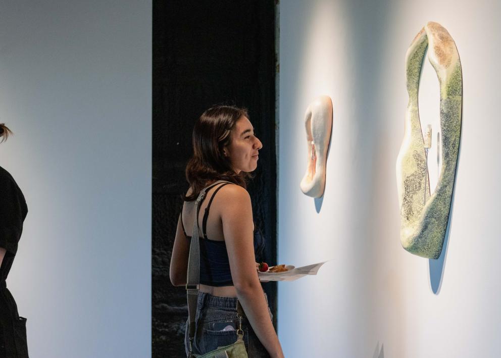 Gallery goer looking at art