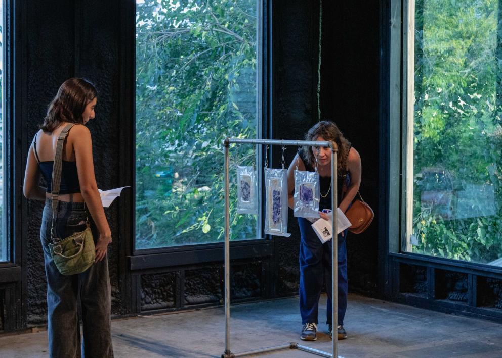 Gallery goers looking at art