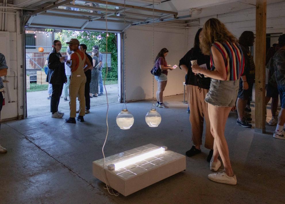 Gallery goers looking at art