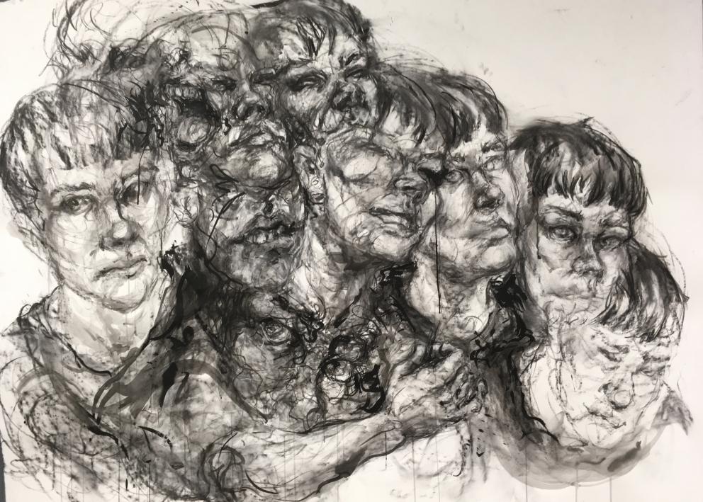 A charcoal drawing of many heads