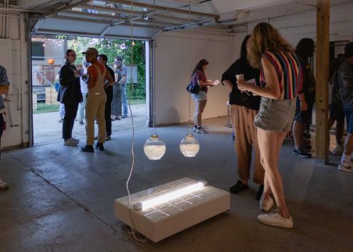 Gallery goers looking at art